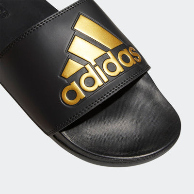 adidas Unisex Adilette Comfort Slide Sandal, Black/Gold Metallic/Black, 13 US Women